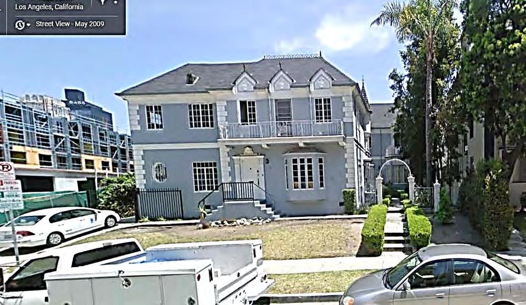 Google Street View, May 2009. Changes reflected in 2009 photograph: Removal of curving hedge at front/west base of building does no favors to the image of the building.
