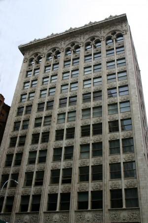 before the plans were finally accepted It is one of the first examples of the Chicago school style of architecture in New York City The division of the building into three sections - an ornamented