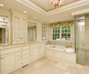 The suite boasts spacious his and her closets with top of the line closet works designs