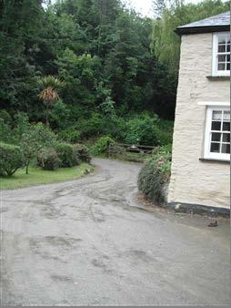 Option 1 (photo below) - There is a gate with 10cm step which leads onto an uneven stone/concrete path in front of the cottage.
