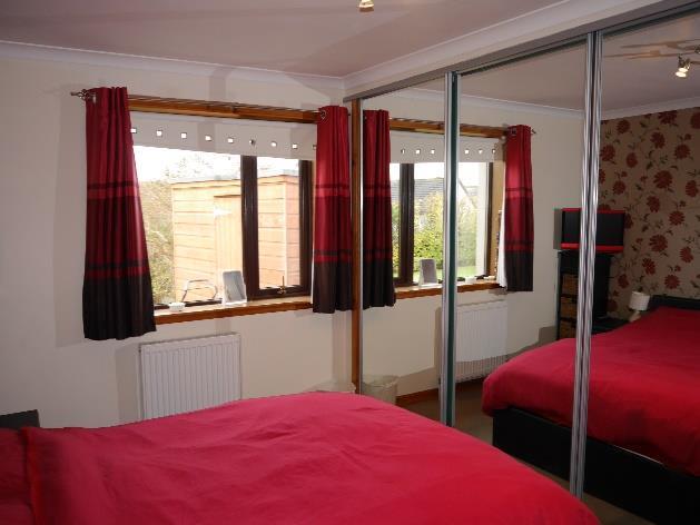 Master Bedroom: Carpet, window, radiator, access to eaves, door