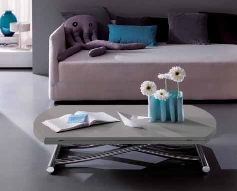 THE SIDE WINGS CAN BE FOLDED UNDER THE TOP TO REDUCE VOLUME OF THE TABLE IN BOTH POSITIONS: EITHER TABLE OR COUCH-TABLE.
