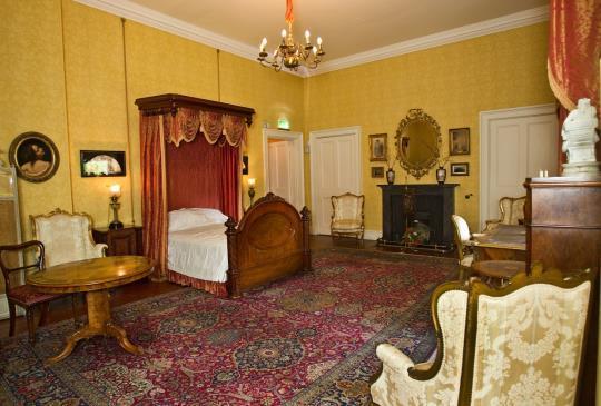 This is the bedroom, which was occupied by the Queen during her visit to Muckross House in 1861.
