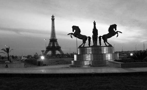 Figure 7 Sculptures of horses - Bahria Town Eiffel Tower in the backdrop. The contrast between what is inside the walls of the Bahria town and what is outside the walls is startling.