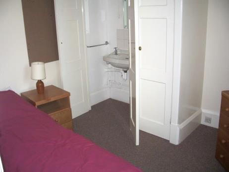 The shared bathroom facilities are situated in the basement below the courts, and there is