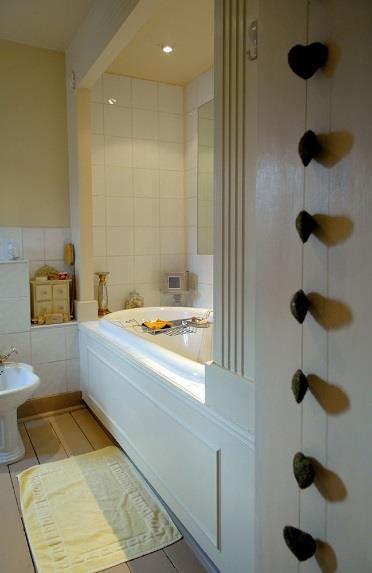 piece period suite including cast iron bath; off the lobby is also a