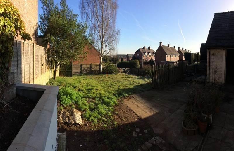 The plot is located to the rear of Holly House, The Cross, Church Street, Malpas, SY14 8NQ and comprises a relatively flat site in an established residential position and with the benefit of a