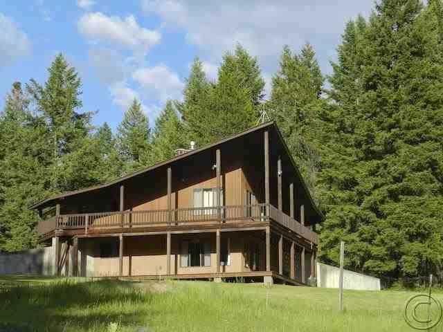 All interior walls on main level are cedar. Decks on main and lower level. Unfinished garage makes for a great carport. All of this on 5.57 acres on the Big Fir Estates subdivision.