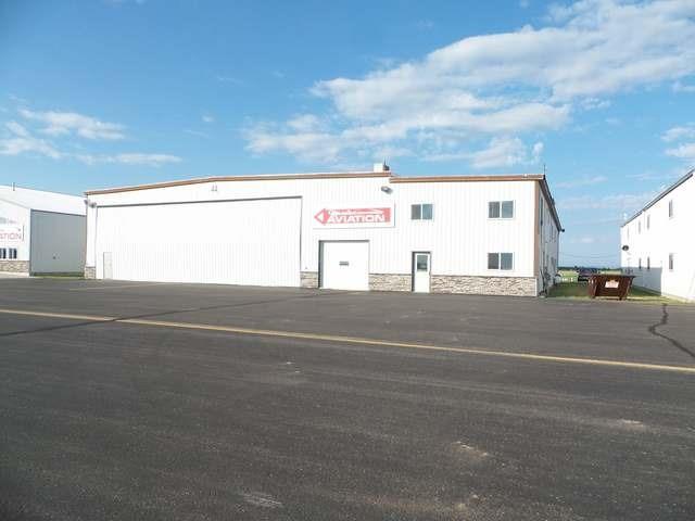 63 acres) I-94 frontage with rural water, zoned industrial, $2.