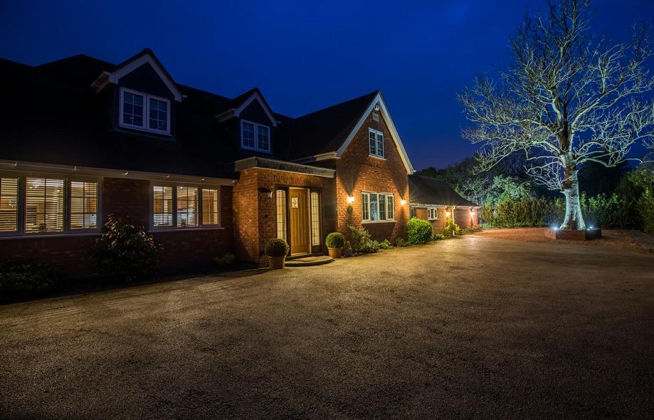 Outside The property is approached via a wide electrically operated gated in-out driveway and leads to the Double Garage which has an electric up and over door.
