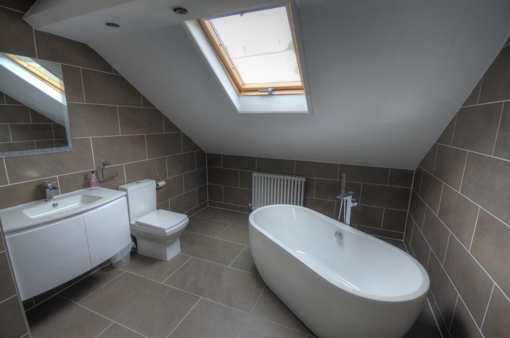 JACK AND JILL EN SUITE 3.85m (12' 8") x 0.95m (3' 1") Fully tiled shower cubicle with mains shower, low flush WC, wash hand basin, heated towel rail, part tiled walls and extractor fan. BEDROOM TWO 3.