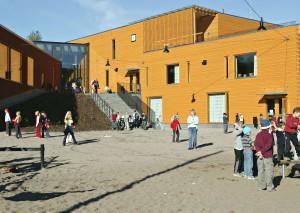 brown, yellow and grey- are reminiscent of traditional Finnish wooden houses and stately manors Seen from the main road it looks as if it has been there for a long time The Sakarinmäki School design