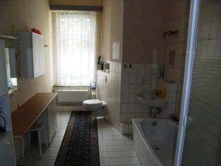 room with sleeping facilities bathroom with shower and bath tub, WC large corridor