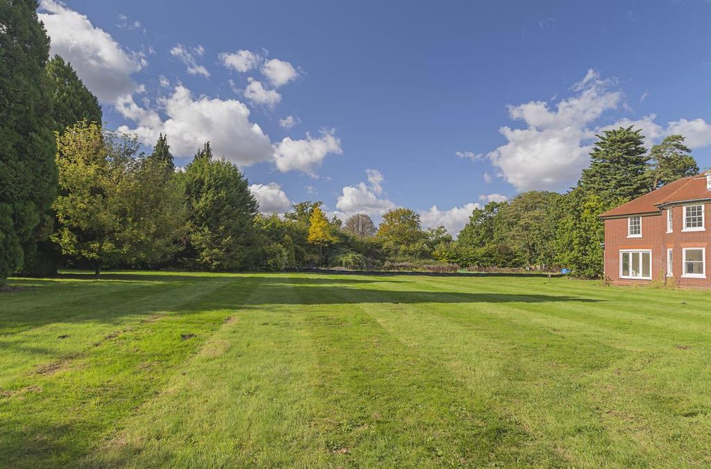 Plot 2, to the west, also has a private gravel drive leading to a triple garage. The garden of this plot also enjoys many mature trees and is surrounded by paddock land which is included in the 3.