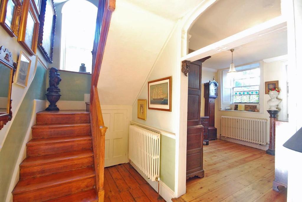 Window over the door, shuttered sash window to the front, wood floorboards with mat well, period style radiator, period fireplace, dental cornice, ceiling rose and pendant light, recessed store
