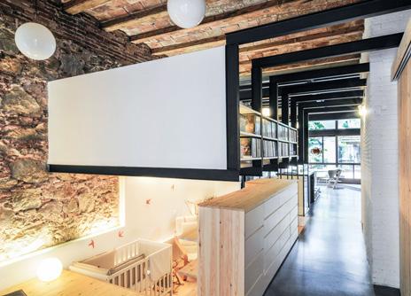 Architect Carles Enrich converted a dilapidated laundry space into this 145 sqm apartment for a young family, keeping the