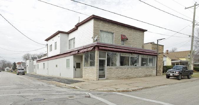 25 acres; zoned C-1 Office area on east end of 1st floor could be another apartment Garage area with 9 x9 overhead door with floor drain 2,756 SF retail/office/service