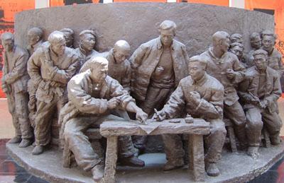 Rural Reforms Sculpture of villagers signing