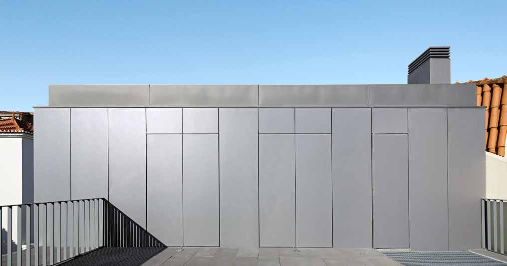 The play of vertical, floor-to-ceiling openings in the façade and clean, white cladding creates an appealing aesthetic.