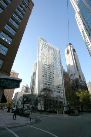 This serves as a counterpoint to the John Hancock building, a few blocks away, which tapers inward from its base Composed entirely in glass, the façade's irregular placement of