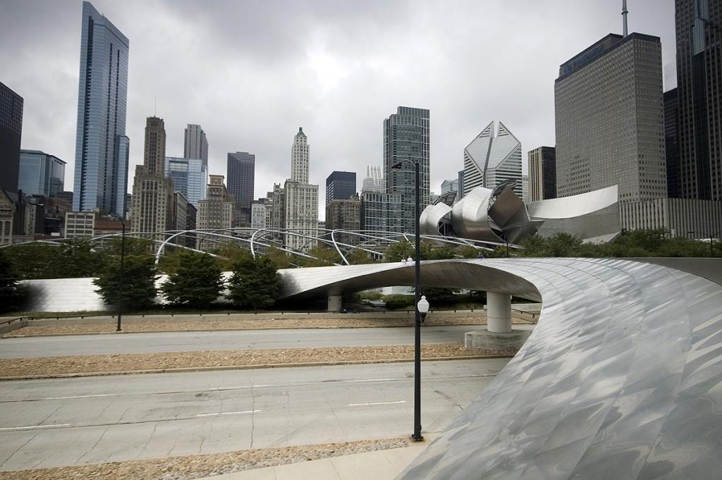 stainless steel panels, the BP Pedestrian Bridge, or simply BP Bridge, complements the Pritzker Pavilion in function as well as design by creating an acoustic barrier from the traffic noise below It