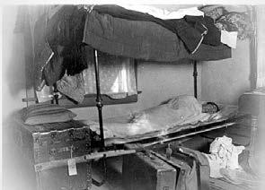 The first bunk beds at the UA. Bottom cot turned upside-down, top cot placed on bottom cot s legs. Probably in South Hall. Anna Maria Aguon Cruz Marylyn M. McEwen, Ph.D.