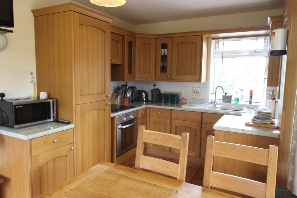 Kitchen/dining room 18 7 x 8 9 Fitted pine units with granite effect work surfaces incorporating ceramic sink and drainer