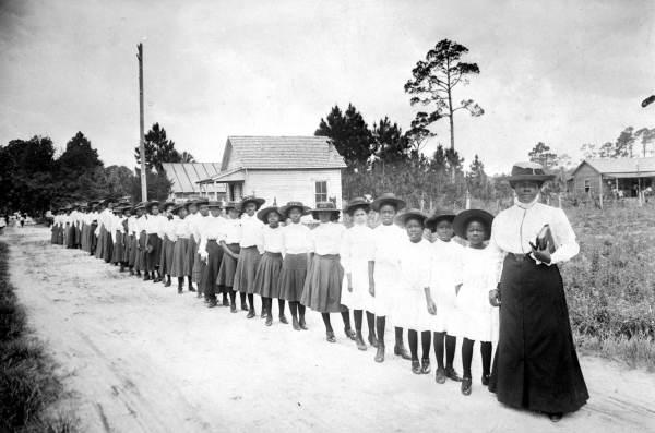 Photo provided by Mary McLeod Bethune Council House National Historic Site, Washington, DC Bethune stands with students from her school, the Daytona