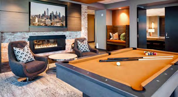 Lobby with concierge Cozy great room with a fireplace Billiards Lounge with Flat Screen TV Shuffleboard Stations Fitness and Yoga Rooms with Free Weights Rooftop deck with skyline views, grills, and
