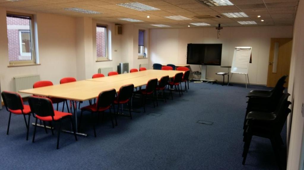 up for 16 people Boardroom style but there is plenty of space to accommodate more table and chairs.