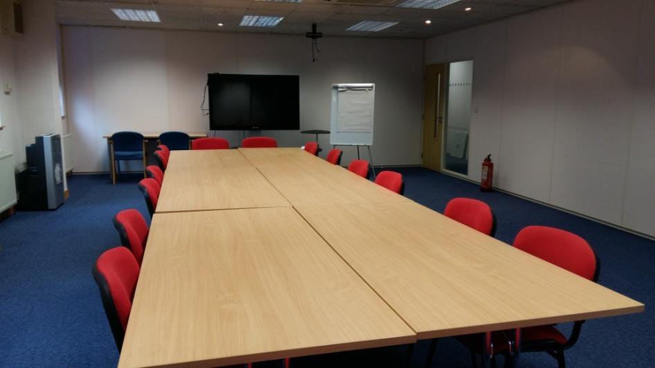 Furniture/equipment: Large TV screen for presentations and flipchart stand.