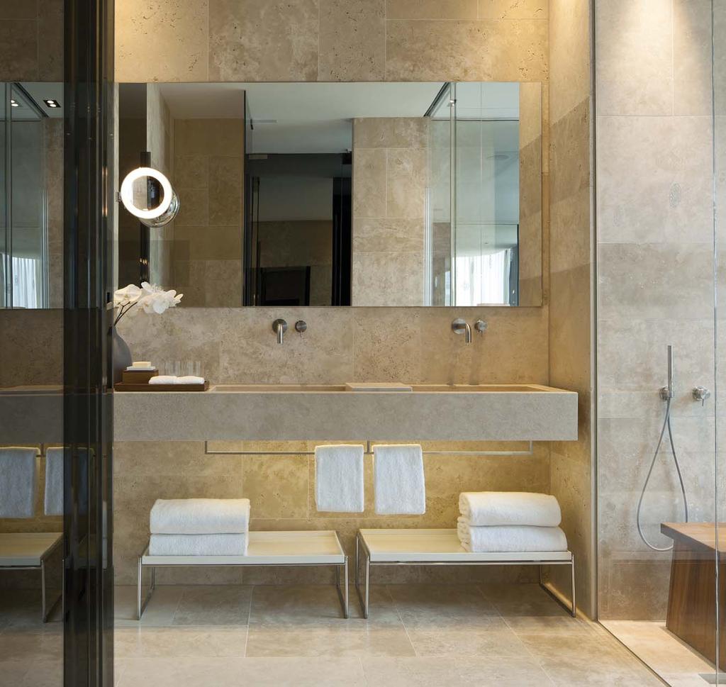 The very spacious bathroom is opulently designed with a bidet, a freestanding oval stone bath and a large separate rainfall shower along with bathroom LCD mirror TV and gorgeously plump