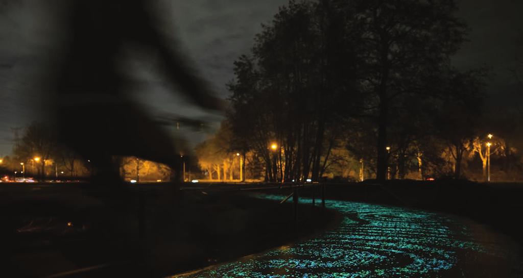 A biker rides along a path in Amsterdam that glows with solar-powered lights. OPTION 2 Topic: (What is the name of the building or public space?) 1. Introduction: (Where is it? Or: Where will it be?