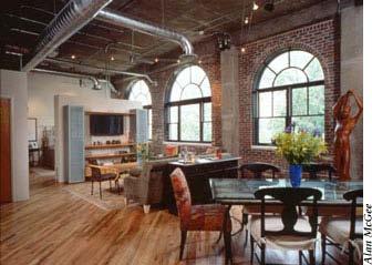Units feature hardwood floors, brick interior