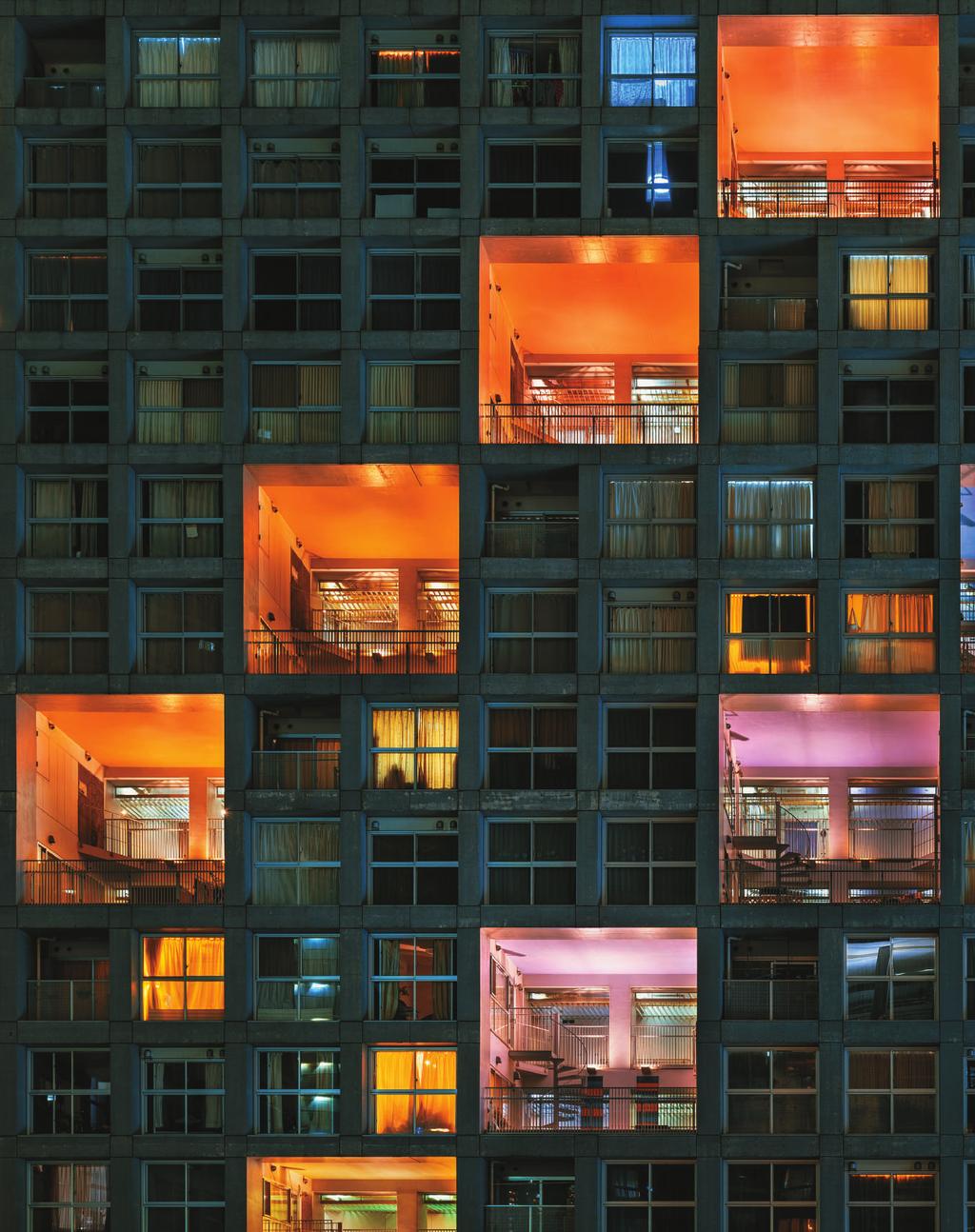 U n i t 4 Housing A modern apartment block is illuminated by
