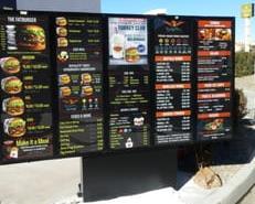 A drive-thru or drive-in sign can be a Changeable Electronic Variable Message Sign (CEVMS) and is exempt from 4.02.06.