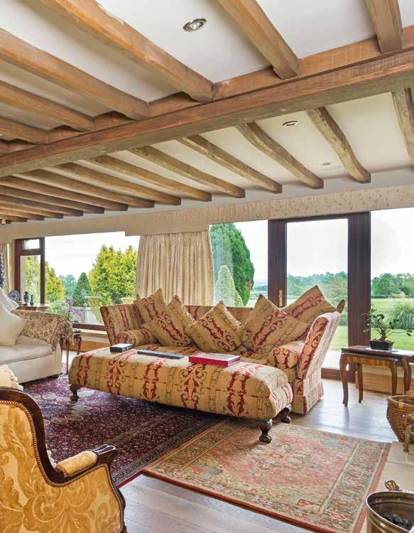 To the right of the staircase is the master bedroom suite which has the added benefit of a balcony with far reaching views over the lake, paddocks and Cotswold countryside views.