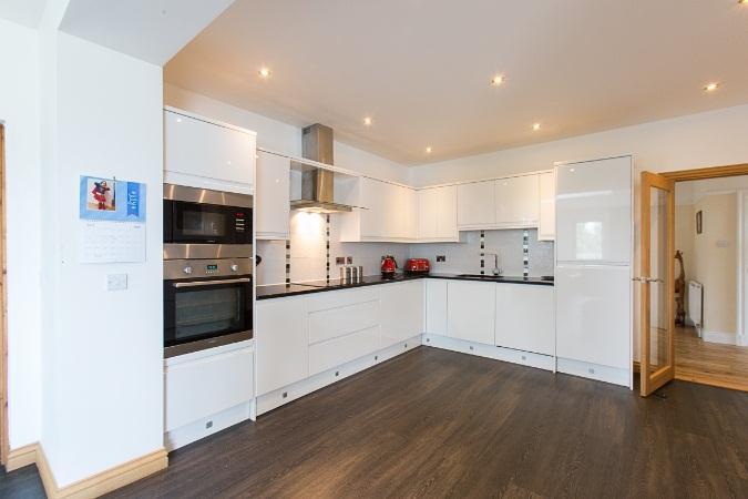 The family area is then open into the modern fitted kitchen with