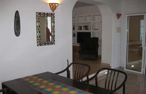 kitchen adjacent to a combined sleeping and living area and a