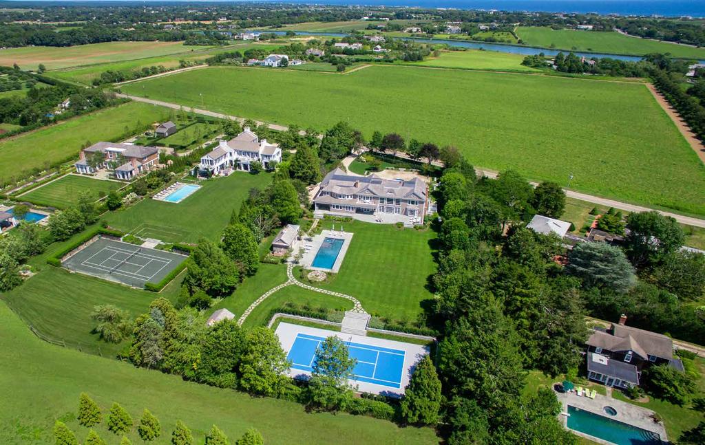 THIS SPRAWLING ESTATE SITS ON 2 + /- GORGEOUS ACRES WITH SWEEPING