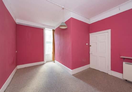 lead to the rear reception room, which could be used as a drawing room or dining room.