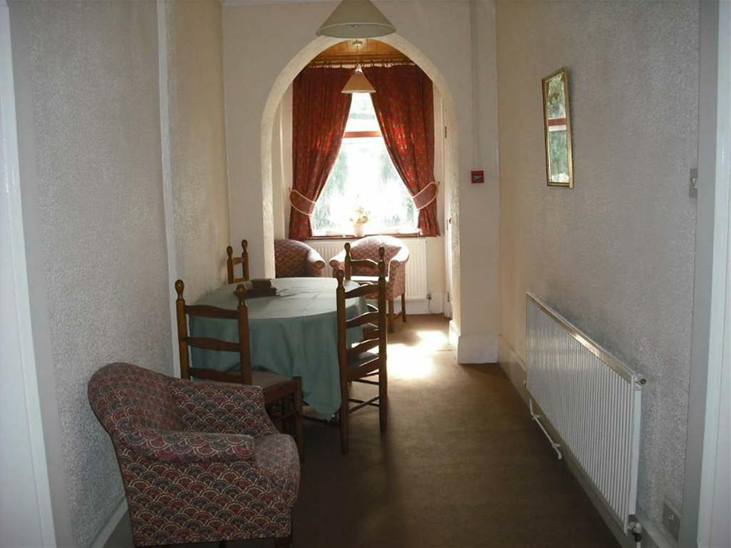 00) Twin beds and radiator Used as dining area with exterior door and cupboard