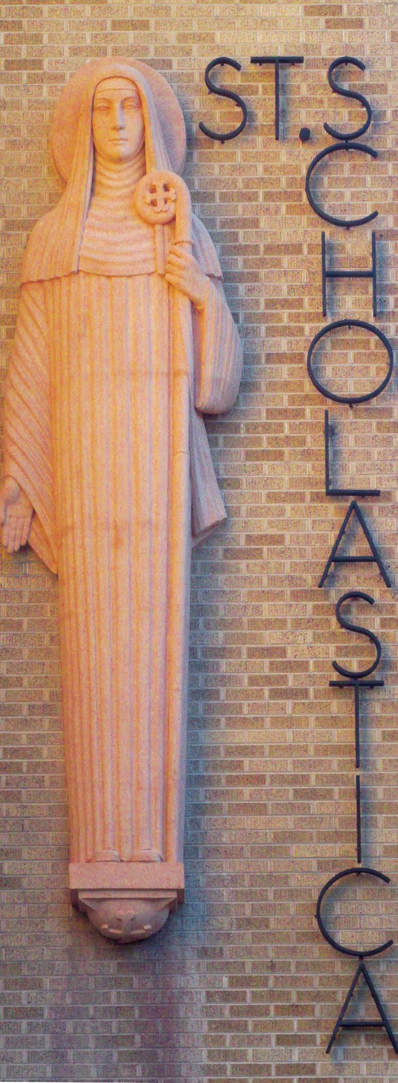 Scholastica s statue, removed when Trinity Junior High School built its athletic center in 2002, was remounted on the school building on November 12.