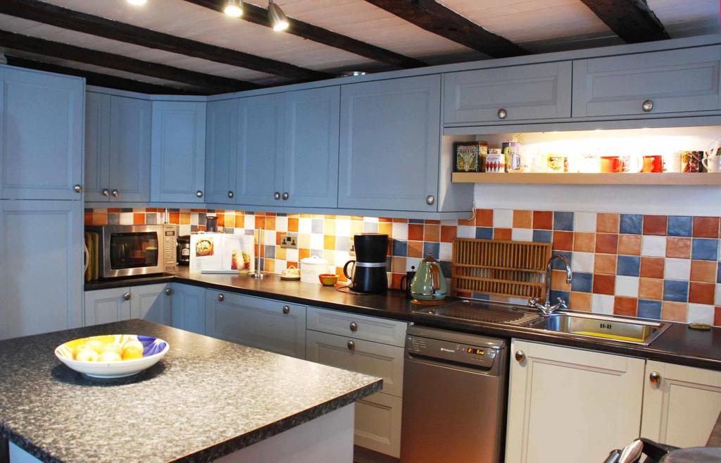 Kitchen: 13 1 x 11 5 Modern fully fitted kitchen; 2 windows west facing; window north