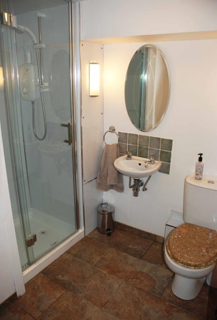 GROUND FLOOR Shower room: 5 9 x 5 White wc and whb; single shower cubicle