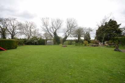 To the rear of the cottage the garden is a particular feature, being of a generous size and laid mainly to lawn