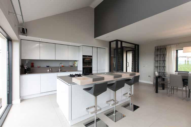 43m) Magnificent Interior 360 bespoke kitchen, Grey ceramic work surface, large centre island with 5 ring gas hob and