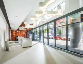 Ceramic floor tiles in the foyer and revolving door system. Access control, security, 24h CCTV. Bright rooms with floor-to-ceiling windows. Office floor planned as an open-plan.