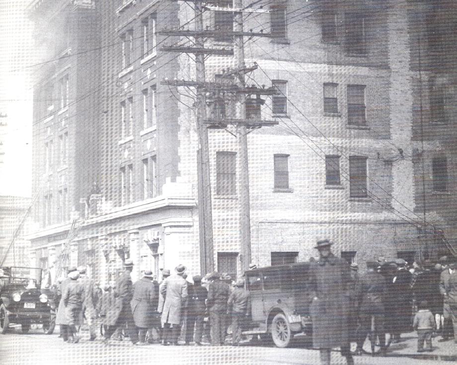 644 PORTAGE AVENUE CASA LOMA BUILDING Plate 17 Onlookers watch as smoke billows from upper-floor windows at the Casa