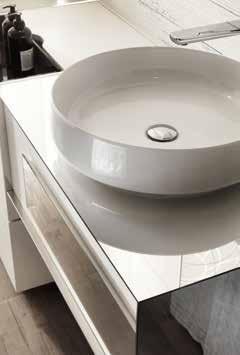 Double washbasin with a practical multifunction base Aladino in the middle.